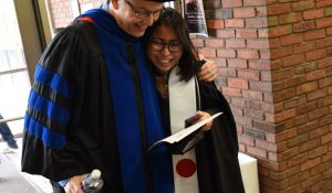 embrace before graduation ceremony